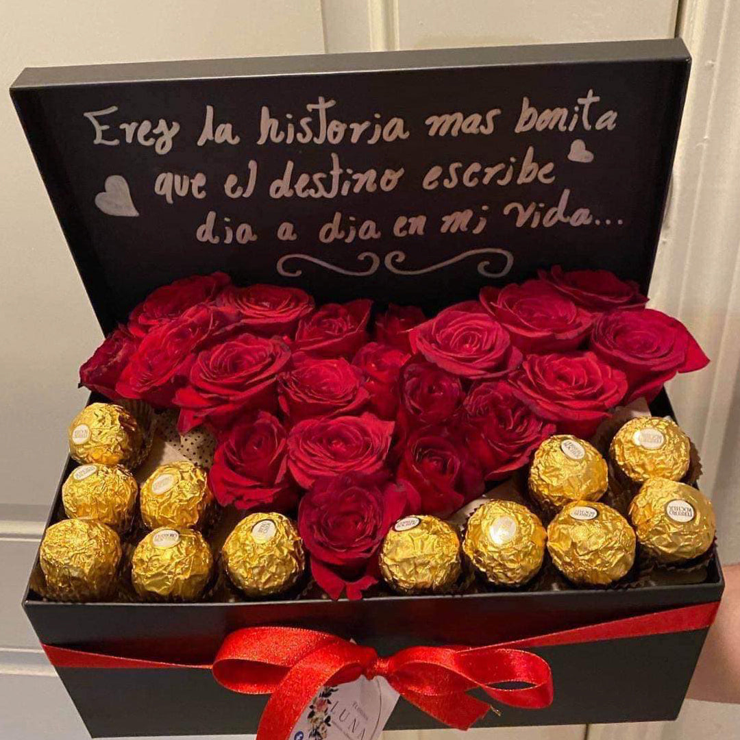 Caja negra con rosas y chocolates